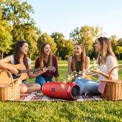 Enceinte bluetooth jeunes filles assises herbe Rontendre